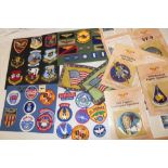 A selection of United States Air Force cloth insignia, badges, wings, two flag emblems etc.