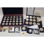 A selection of various gilt commemorative coins and crowns including Royal Weddings,