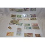 A selection of mixed Foreign bank notes and a small quantity of ½p coins