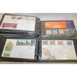 Two albums containing a selection of GB first day covers and various other postal covers etc.