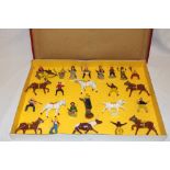 A boxed set of British made painted lead Cowboy and Indian figures with horses