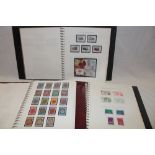 Three albums containing a collection of Guernsey mint and used stamps,