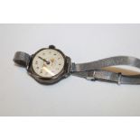 A ladies' vintage silver wristwatch with decorated circular dial and nickel-plated strap