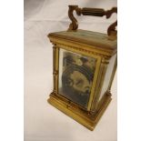 A good quality chiming carriage clock with rectangular enamelled dial in brass traditional glazed