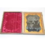 A Victorian Daguerreotype-style photograph of two children in Morocco leather case