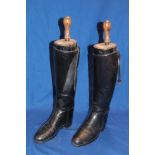 A pair of ladies' black leather riding boots with wooden trees by Rowell & Sons of Melton Mowbray