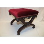 A Victorian mahogany X-frame square stool with upholstered seat on scroll supports