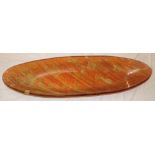 An unusual 1990's art glass boat-shaped bowl with mottled orange decoration,