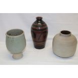 A Zade pottery tapered vase with brown and black lined decoration and two other various Zade