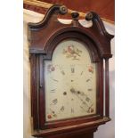 A 19th century longcase clock with 12" painted arched dial and 8 day movement in oak traditional