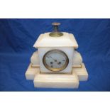 A 19th century French mantel clock with circular dial in polished white marble and brass mounted
