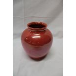 A Moorcroft pottery orange glazed tapered vase,