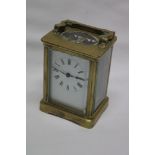 A French carriage clock with enamelled rectangular dial in brass traditional glazed case