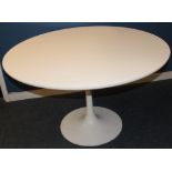 A Vintage-style circular dining table by Arkana with white finished circular top on aluminium