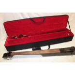 A Dean Pace electric upright stick bass guitar in fitted case