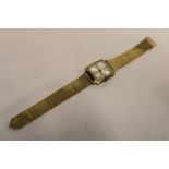 A gentlemans wrist watch by Lings with silvered square dial in gold plated mounts