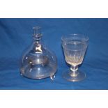 An early 19th century glass fly trap on three tapered legs and a 19th century cut-glass rummer