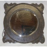 A good quality bevelled wall mirror in embossed oak square frame,