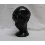 A Dartmouth Devon pottery black glazed figure of a female's head,
