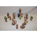 A collection of twelve various Hummel china figures of children including two boxed examples