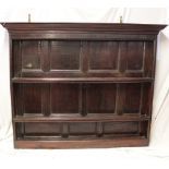 An 18th century oak rectangular dresser back/plate rack with panelled back and moulded cornice,