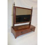 An old polished mahogany rectangular toilet mirror with fluted supports and two base drawers