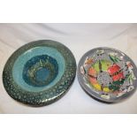 A studio pottery circular bowl with blue and green lined decoration,