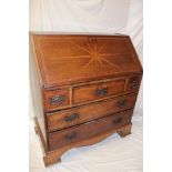 A 19th century inlaid oak bureau with drawers,