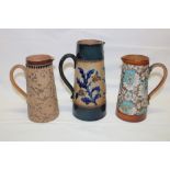 A Doulton Lambeth pottery tapered jug with raised leaf decoration 8¼" high and two other various