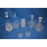 A pair of good quality cut-glass tapered decanters and stoppers with star-cut bases,