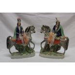 A pair of Victorian Staffordshire pottery figures of Highlanders on horseback,