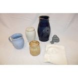 A selection of studio pottery including blue glazed seated figure,