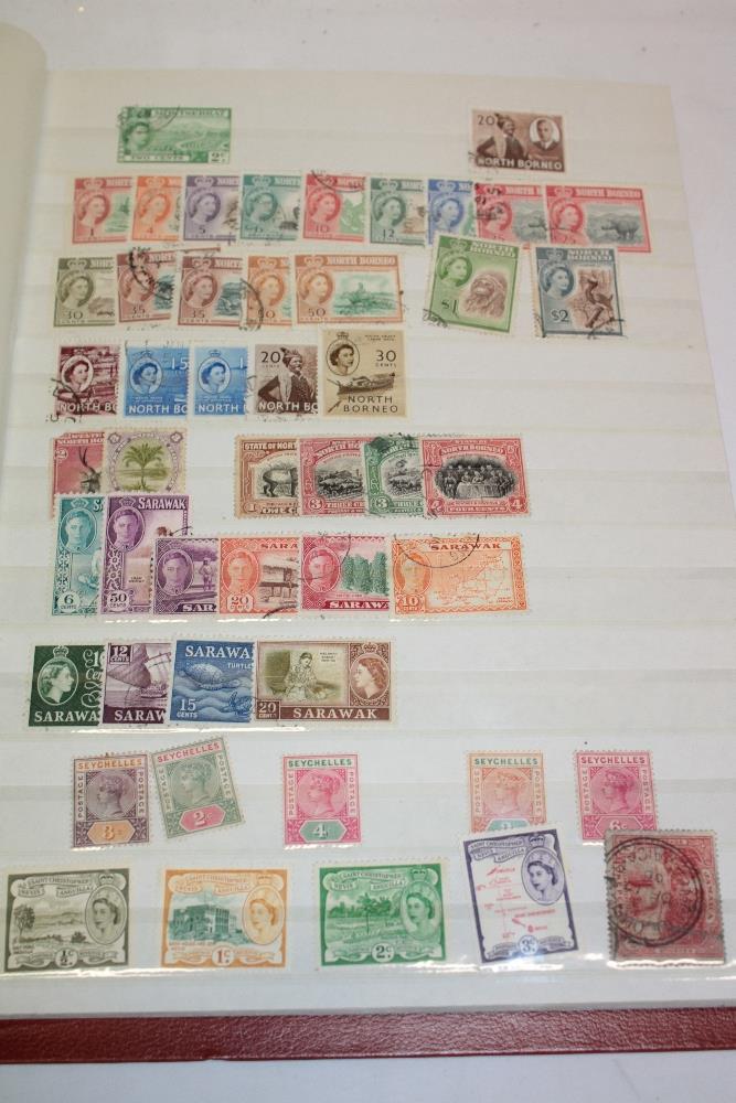 A stock book containing a selection of British Commonwealth stamps