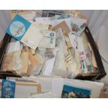 A box containing a large selection of various World stamps in packets, postal covers etc.