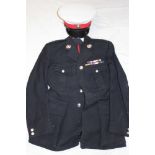 A Royal Marine's Officer's uniform comprising a blue four pocket tunic with anodised buttons and