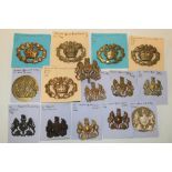 A selection of various Warrant Officers insignia including general service badges in brass,