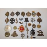 A selection of various Military badges including REME, Leicester Regiment,