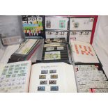 Eight albums and stock books containing a selection of GB mint and used stamps,