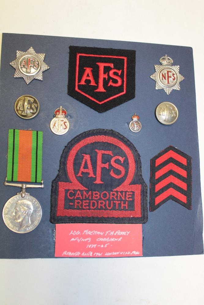 A selection of Auxiliary Fire Service badges and insignia formerly the property of Leading Fireman