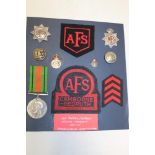 A selection of Auxiliary Fire Service badges and insignia formerly the property of Leading Fireman