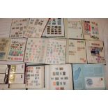 Fourteen albums and stock books containing a large selection of World stamps