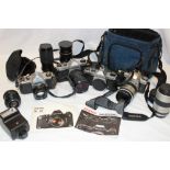 A Pentax MZ-30 camera, two Pentax K1000 cameras, Pentax Asahi camera,