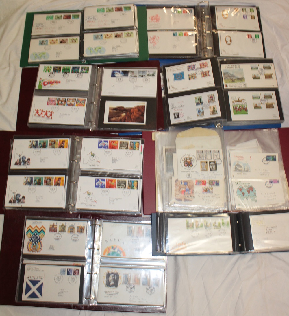Eight folder albums containing a large selection of GB first day covers,
