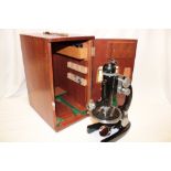 A monocular microscope by J Swift & Sons London in fitted mahogany case with accessories