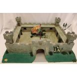 A wooden scale built model fort 25" long