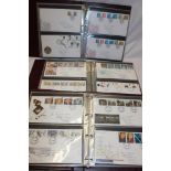 Three folder albums containing a collection of over 200 GB first day covers,