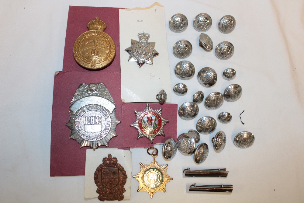 Various Police and Fire Brigade badges and buttons including British Honduras Police cap badge,