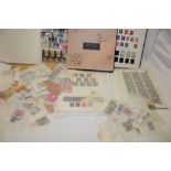 A box containing an album of GB stamps, stock book of World stamps, various postal covers,