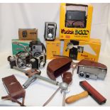 A selection of various Kodak cameras together with accessories, boxed flash light,