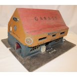 A wooden constructed toy garage and one other wooden garage (2)